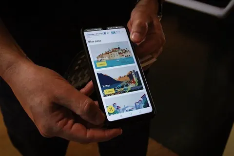 The Blue Pass EXChAngE mobile application displayed on a smartphone, connecting visitors with the region’s natural and cultural heritage and thematic routes.