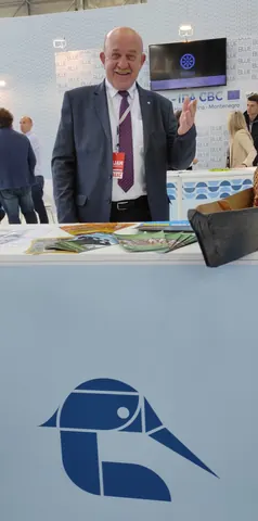 Nikola Zovko at the EXCHANGE exhibition stand, representing Hutovo Blato Nature Park within the cross-border partnership.