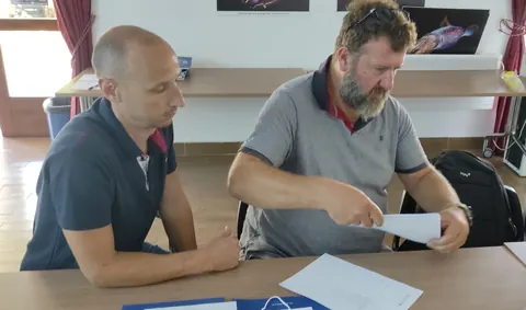 Nenad Antolović and Nikša Glavić preparing partnership agreement documentation during the EXCHANGE kick-off meeting in Kotor.